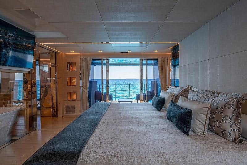 a large living room with a large glass door aboard LEL Yacht for Charter