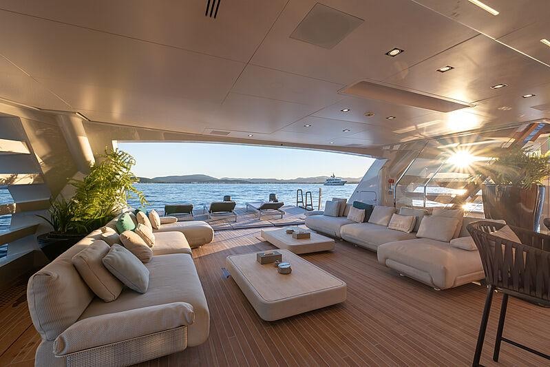 a living room with a large swimming pool aboard LEL Yacht for Charter