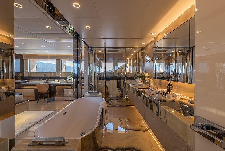 a large room with tables and chairs aboard LEL Yacht for Charter