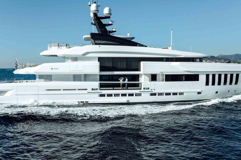 a large white boat in the water aboard OURANOS Yacht for Charter
