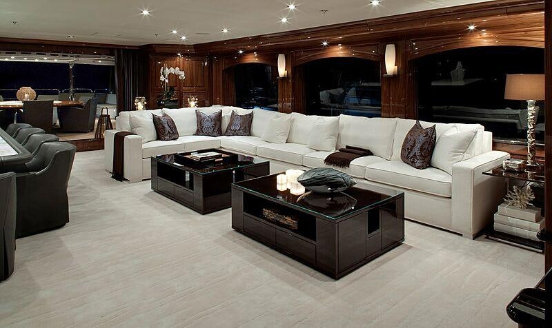 a living room with a large mirror aboard REMEMBER WHEN Yacht for Charter