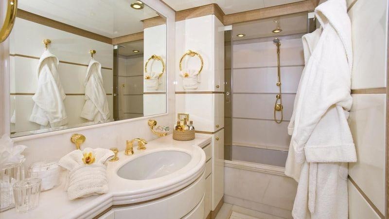 a bathroom with a sink and bathtub aboard TE MANU Yacht for Charter