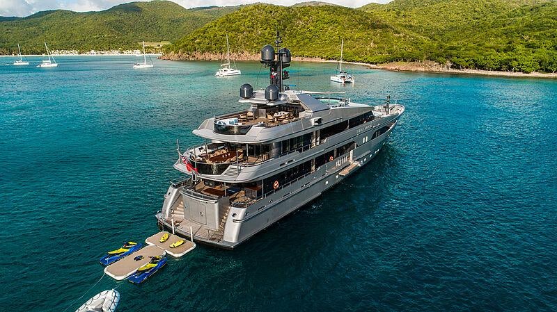 a large ship in the water aboard VIBRANCE Yacht for Charter