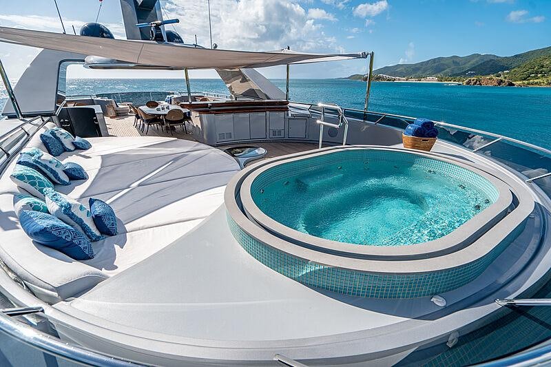 a swimming pool on a deck aboard VIBRANCE Yacht for Charter