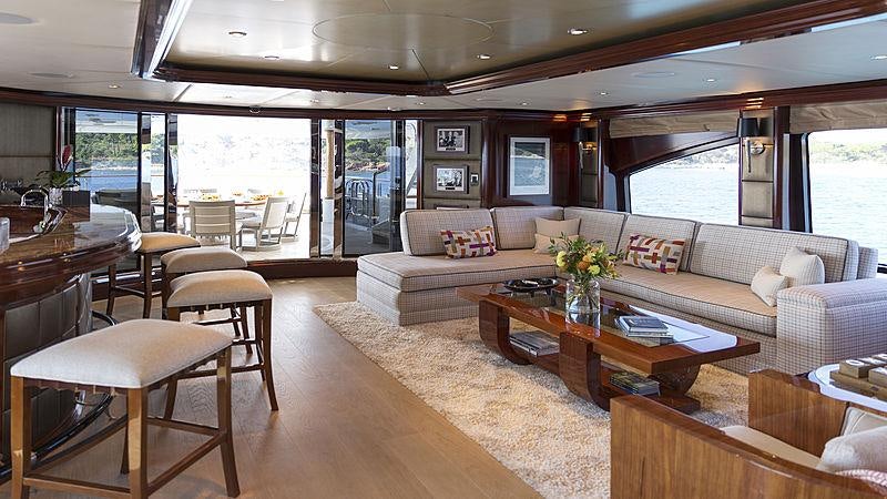 a living room with a large window aboard LA DEA II Yacht for Charter