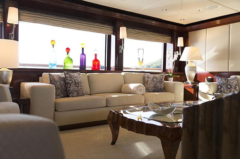 a living room with a couch and a table aboard LA DEA II Yacht for Charter