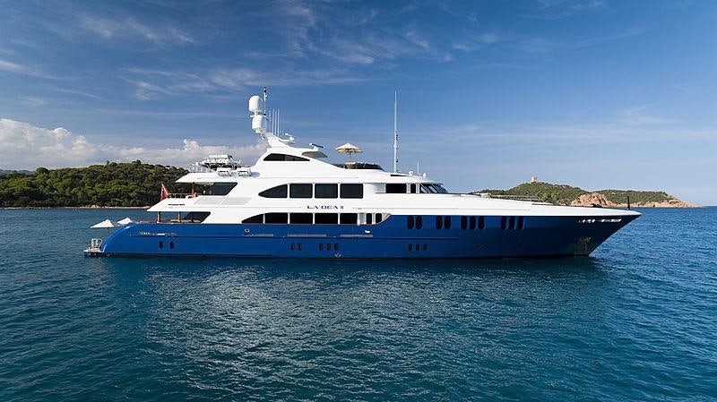 a large white boat in the water aboard LA DEA II Yacht for Charter