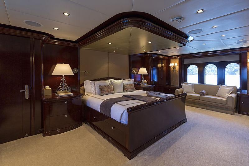 a large bedroom with a large bed aboard LA DEA II Yacht for Charter