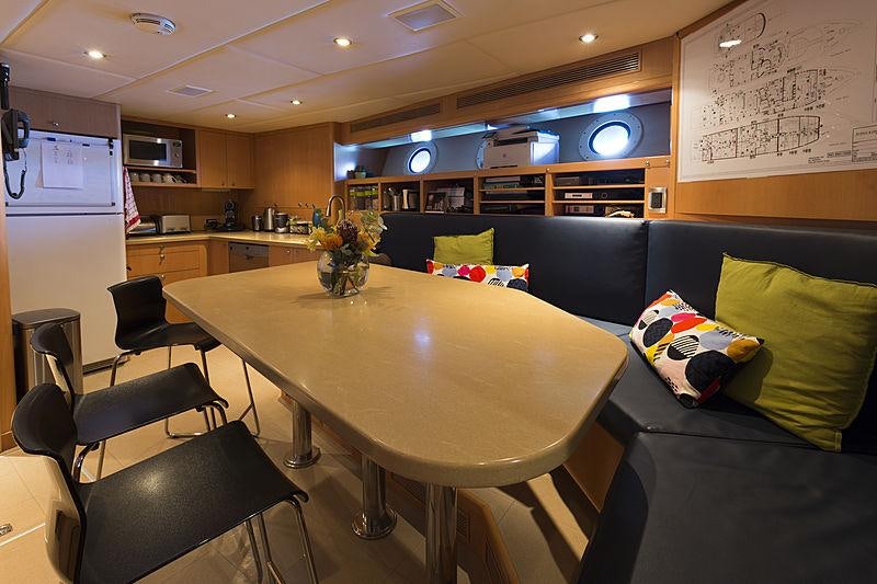 a large kitchen and living room aboard LA DEA II Yacht for Charter