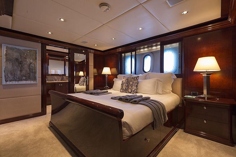 a large bed in a hotel room aboard LA DEA II Yacht for Charter