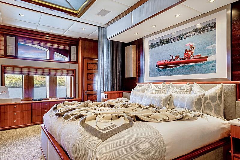 a bedroom with a large bed aboard OCEAN CLUB Yacht for Charter