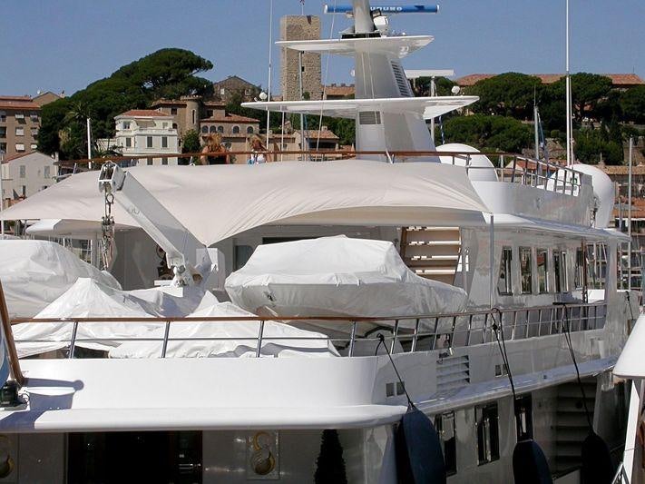 a large white boat with a white roof aboard SHAKE N' BAKE TBD Yacht for Charter