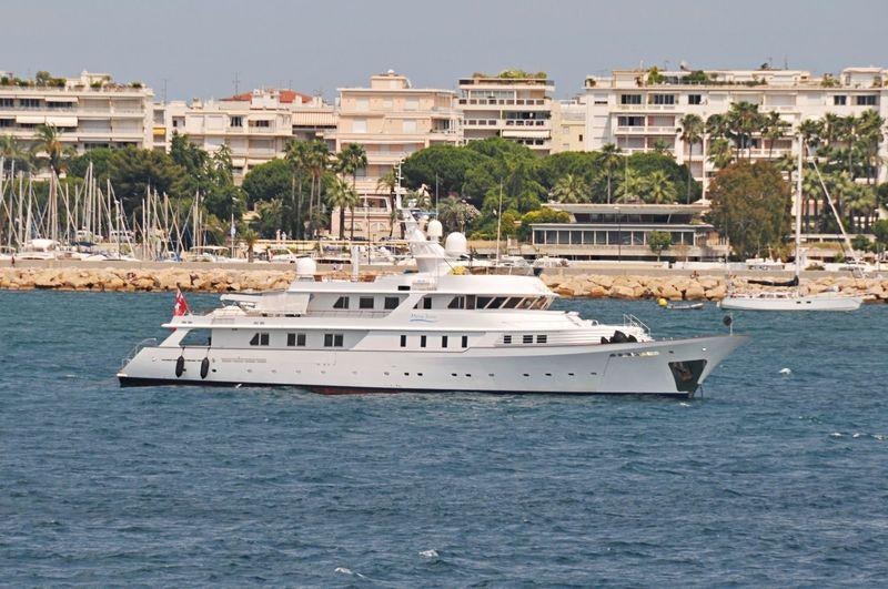 a white boat in the water aboard SHAKE N' BAKE TBD Yacht for Charter