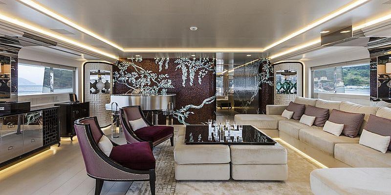 a living room with a large screen aboard PARILLION Yacht for Charter