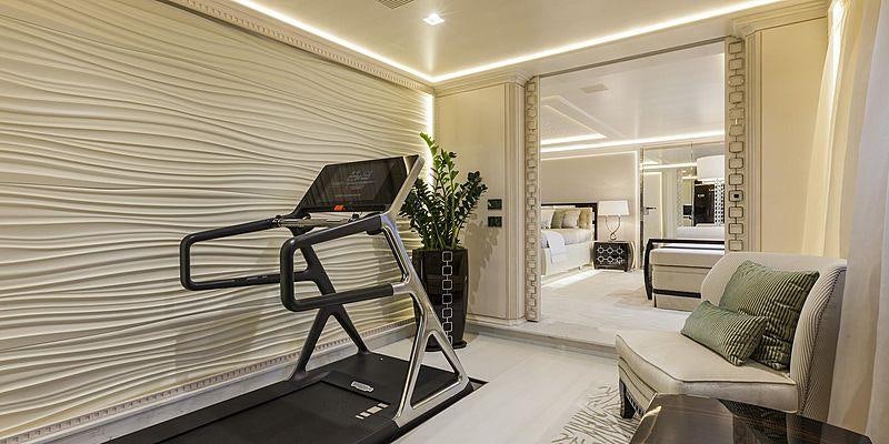 a room with a bed and a desk aboard PARILLION Yacht for Charter