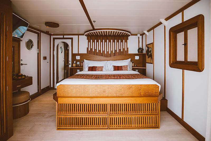 a bed in a room aboard KUDANIL EXPLORER Yacht for Charter