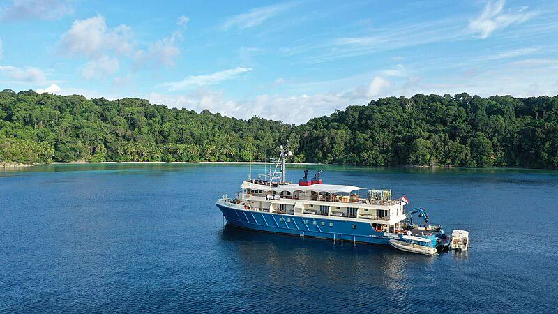 a large boat on the water aboard KUDANIL EXPLORER Yacht for Charter