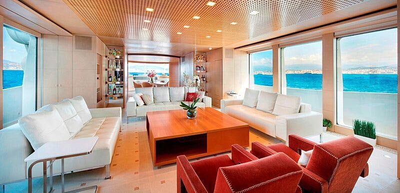 a living room with a table and chairs aboard LUISA Yacht for Charter