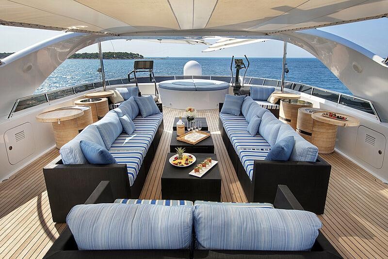 a boat with a table and chairs aboard LUISA Yacht for Charter