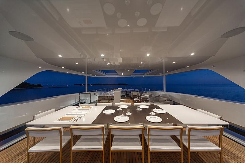 a room with a table and chairs aboard MY MAYVA Yacht for Charter