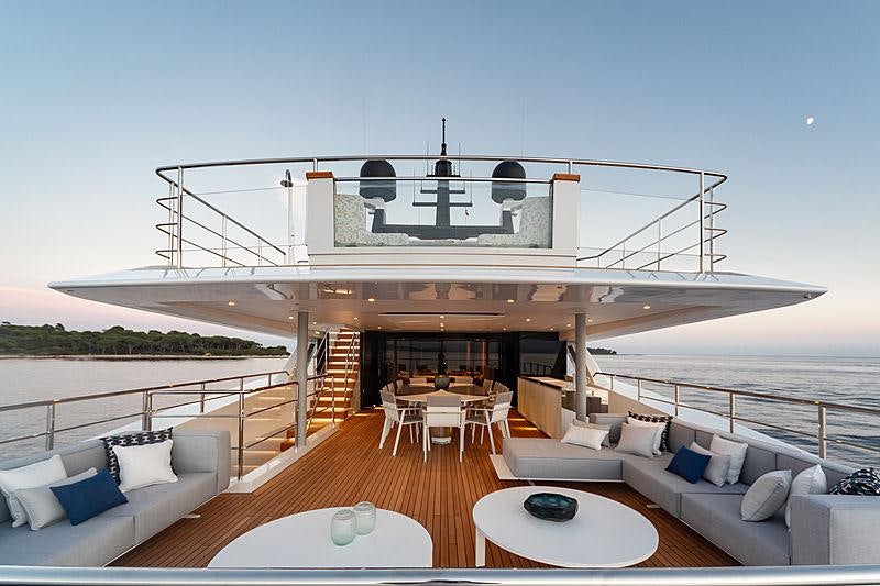 a large white building with a balcony aboard MY MAYVA Yacht for Charter