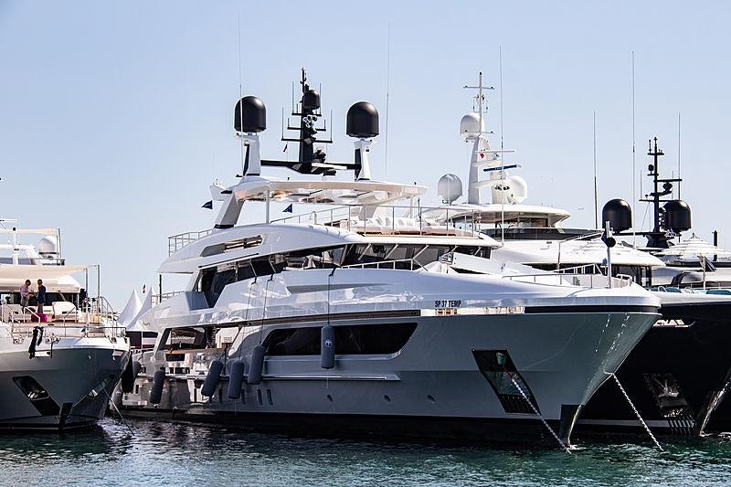 a couple of large boats in the water aboard MY MAYVA Yacht for Charter