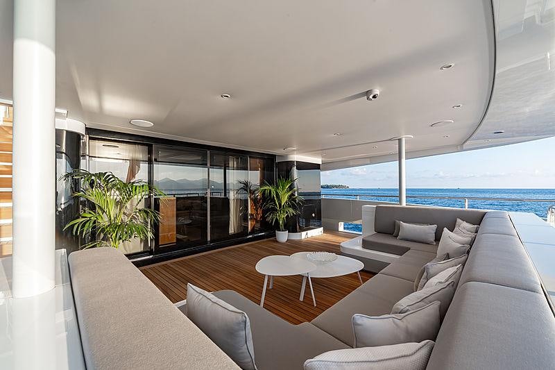 a living room with a large window aboard MY MAYVA Yacht for Charter