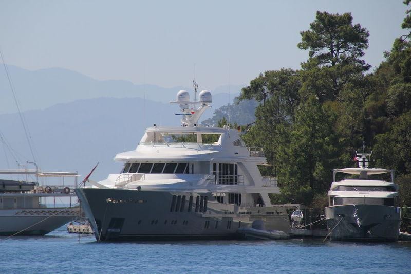 a large white boat in the water aboard ORIENT STAR Yacht for Charter