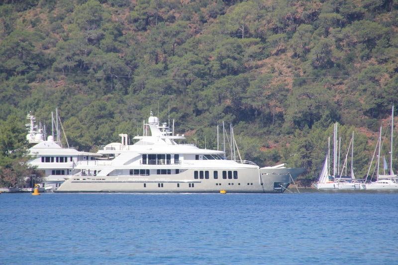 a large white boat in the water aboard ORIENT STAR Yacht for Charter