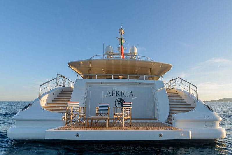 a large white boat on a body of water aboard AFRICA I Yacht for Charter