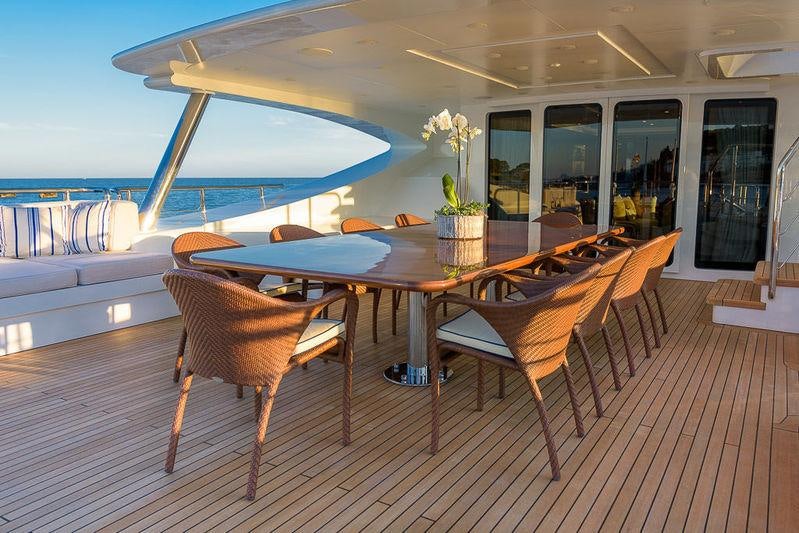 a table and chairs on a deck aboard AFRICA I Yacht for Charter