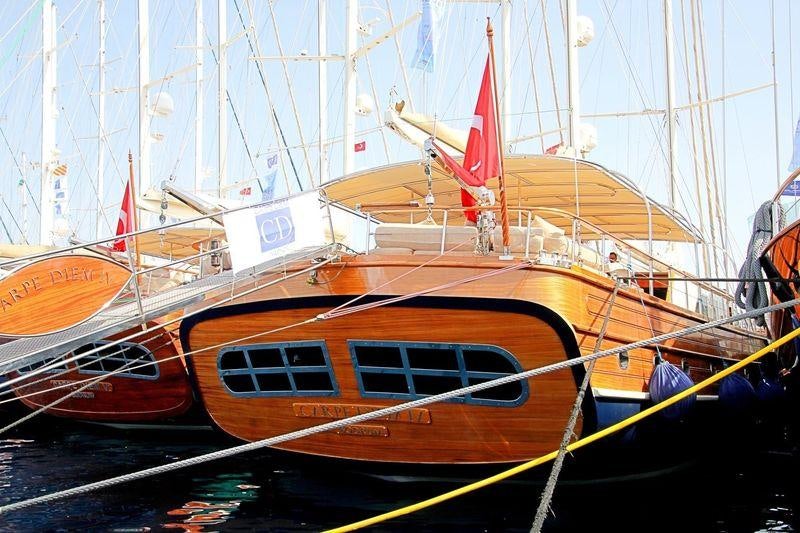 a couple of boats sit on a dock aboard LA BELLA VITA Yacht for Charter