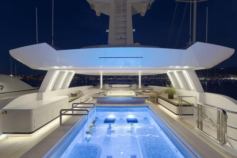 a large white building with a pool aboard LIQUID SKY Yacht for Charter