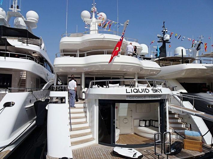 a boat with a ladder on the deck aboard LIQUID SKY Yacht for Charter