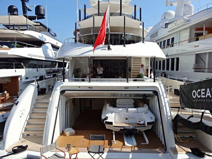 a boat with a table and chairs aboard ODYSSEA Yacht for Charter