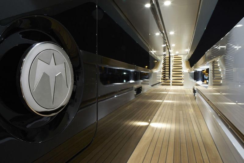 a large tunnel with a large clock aboard MR. T Yacht for Charter