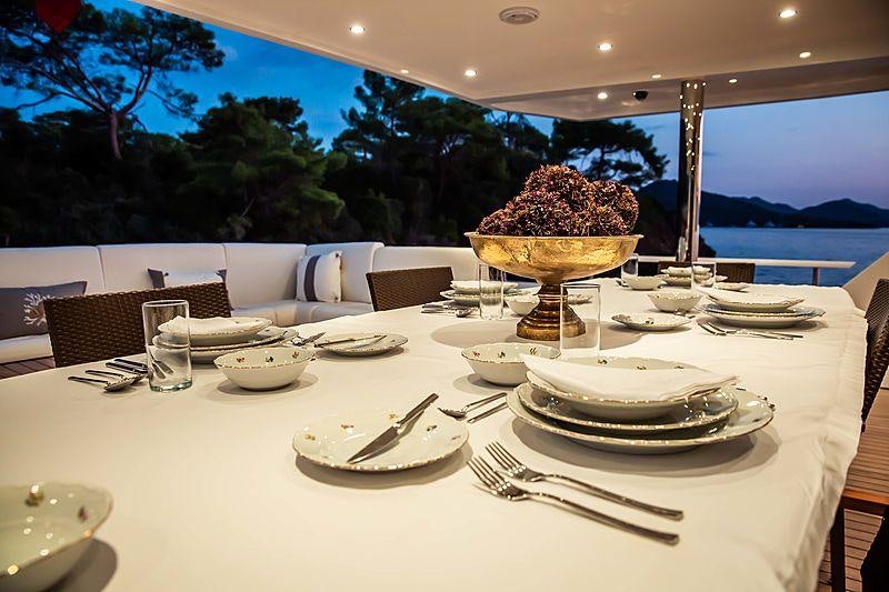 a large cake on a table aboard OCEAN BREEZE Yacht for Charter