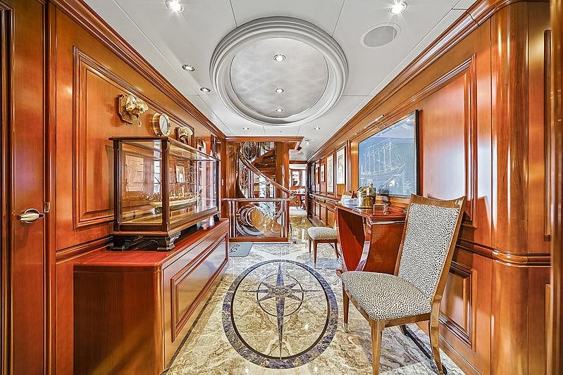 a room with a chair and a table aboard ARTEMIS Yacht for Charter