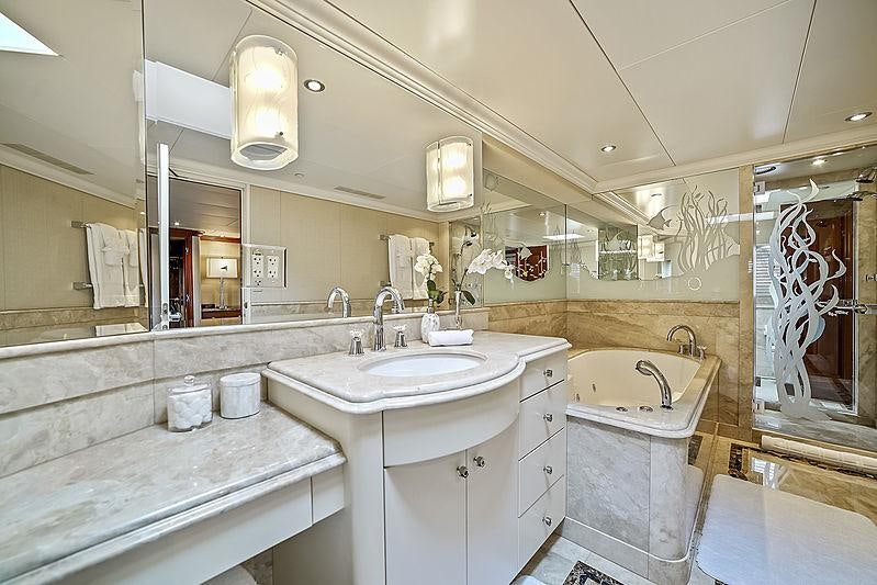 a bathroom with a sink and a bathtub aboard ARTEMIS Yacht for Charter