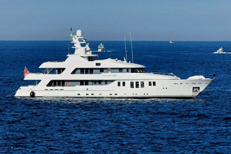 a white boat in the water aboard MY LITTLE VIOLET Yacht for Charter