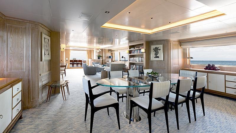 a large kitchen with a dining table aboard GOLDEN EAGLE Yacht for Charter
