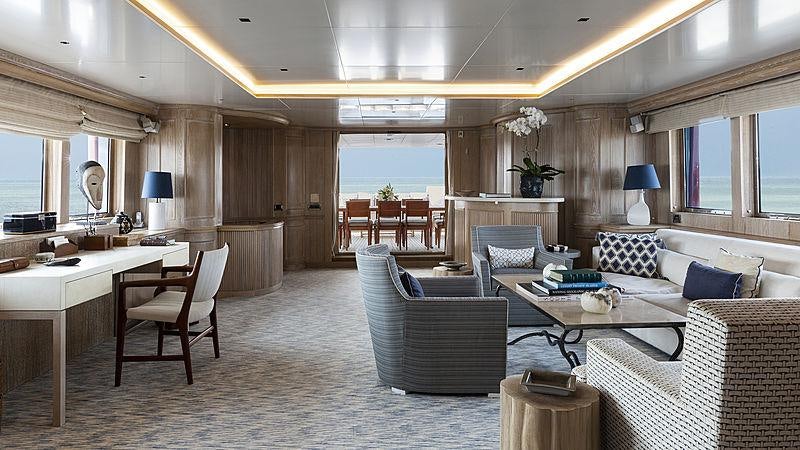 a living room with a large window aboard GOLDEN EAGLE Yacht for Charter