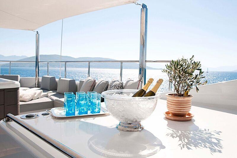 a table with food and drinks on it aboard BELLA STELLA Yacht for Charter