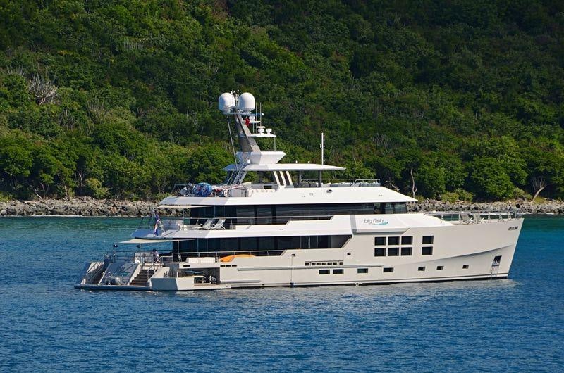 a large white boat in the water aboard BIG FISH Yacht for Charter