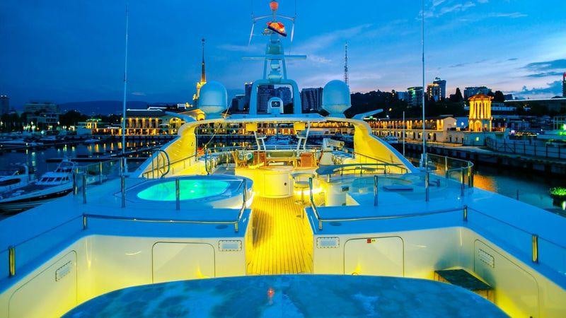 a large ship in a harbor aboard AMADEUS I Yacht for Charter