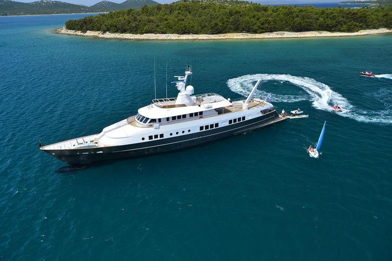 a boat with a helicopter on it aboard BERZINC Yacht for Charter