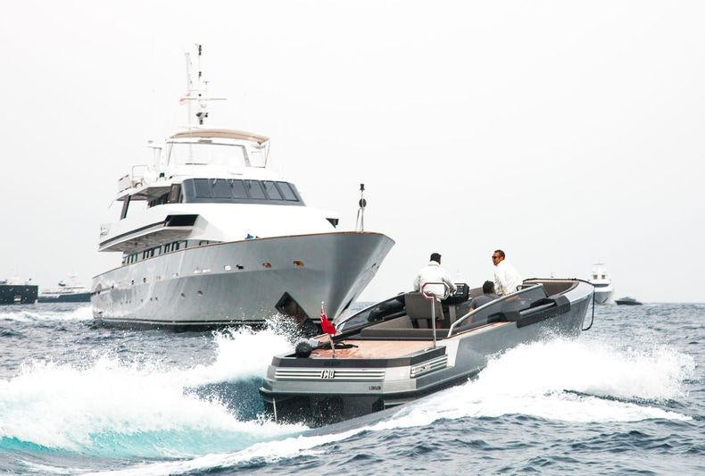 a couple of boats in the water aboard COSTA MAGNA Yacht for Charter
