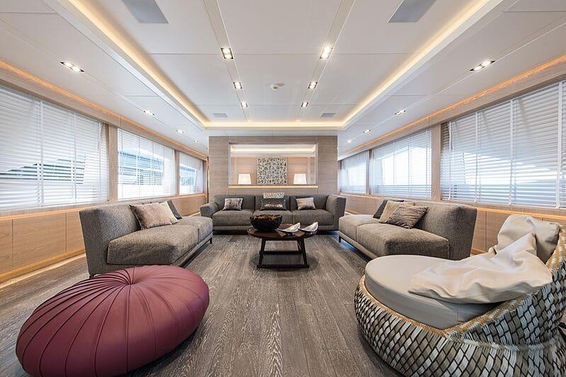 a living room with a large window aboard FAST & FURIOUS Yacht for Charter