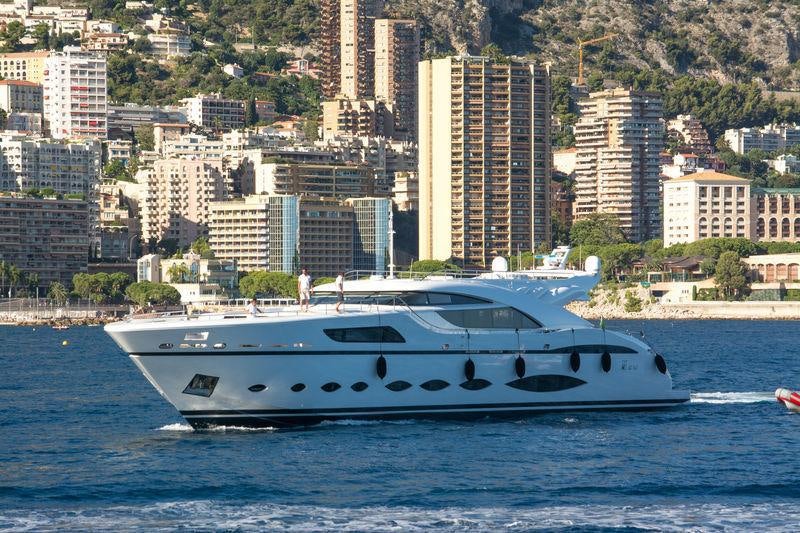 a white yacht in the water aboard FAST & FURIOUS Yacht for Charter