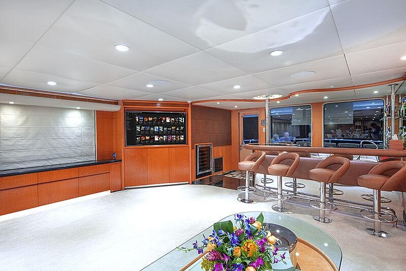 a large room with chairs and tables aboard ISLAND HEIRESS Yacht for Charter